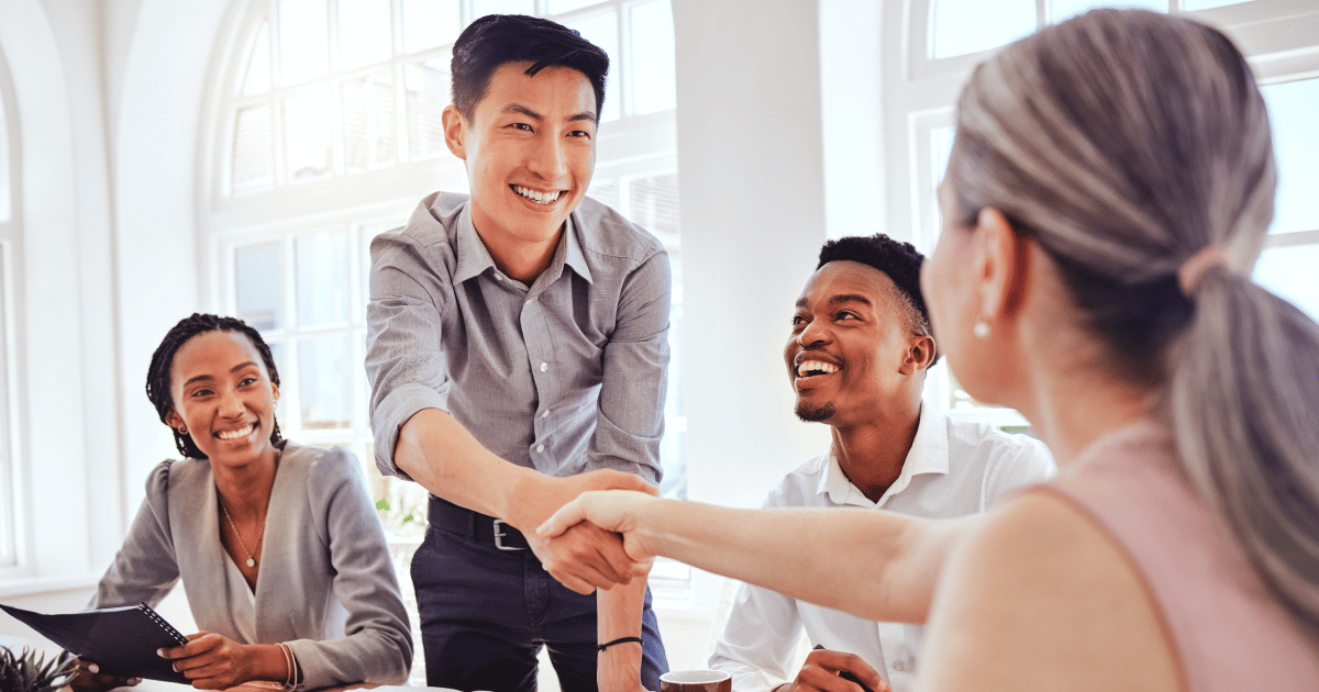 shaking hands in a business setting