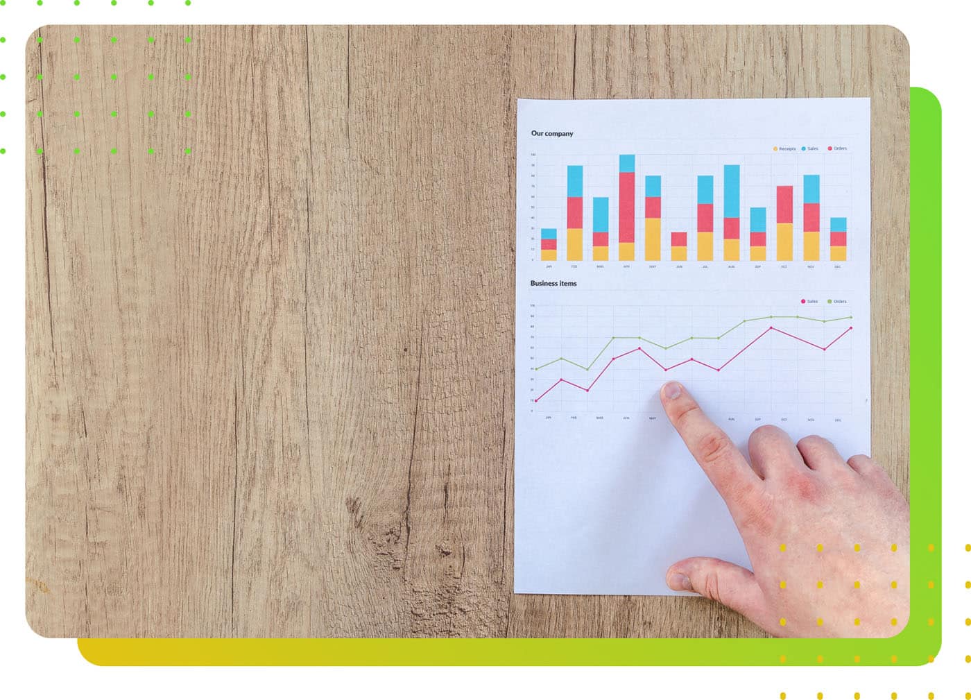 A hand pointing at a graph and chart