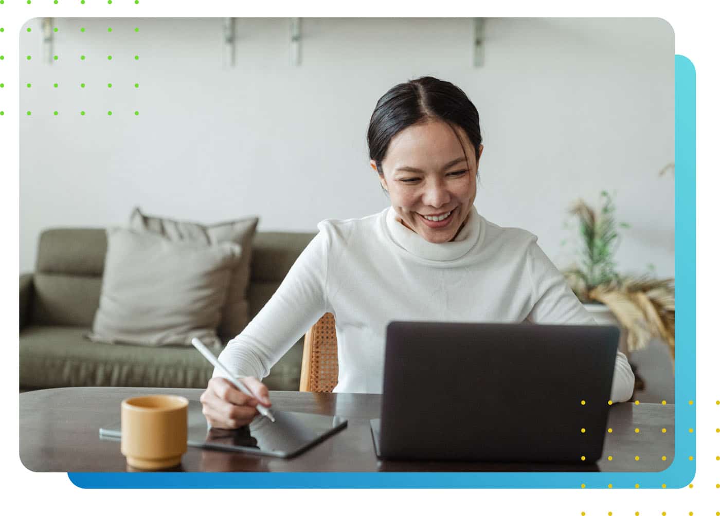 A happy worker in front of a laptop