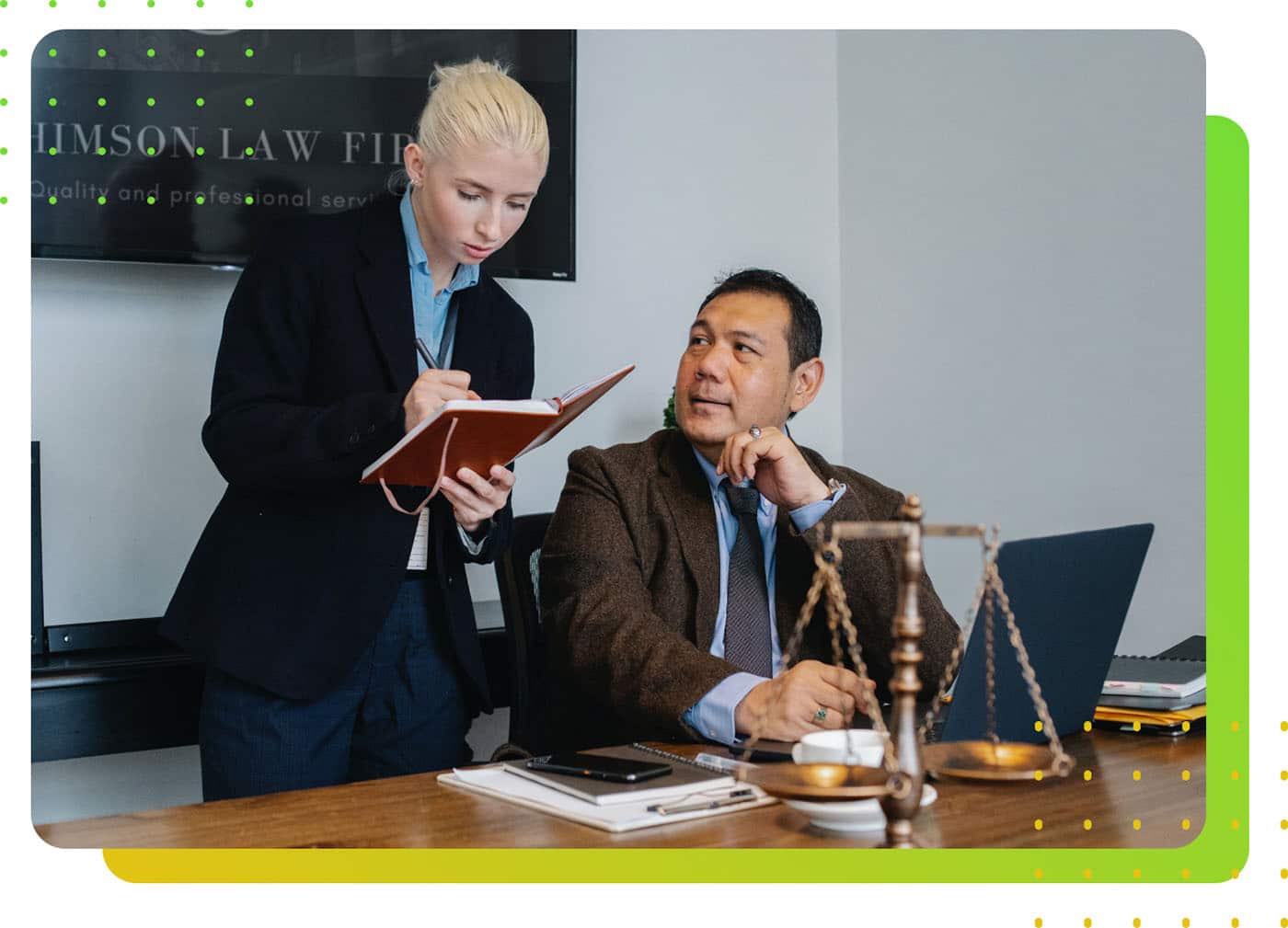 A man and a woman discussing while working