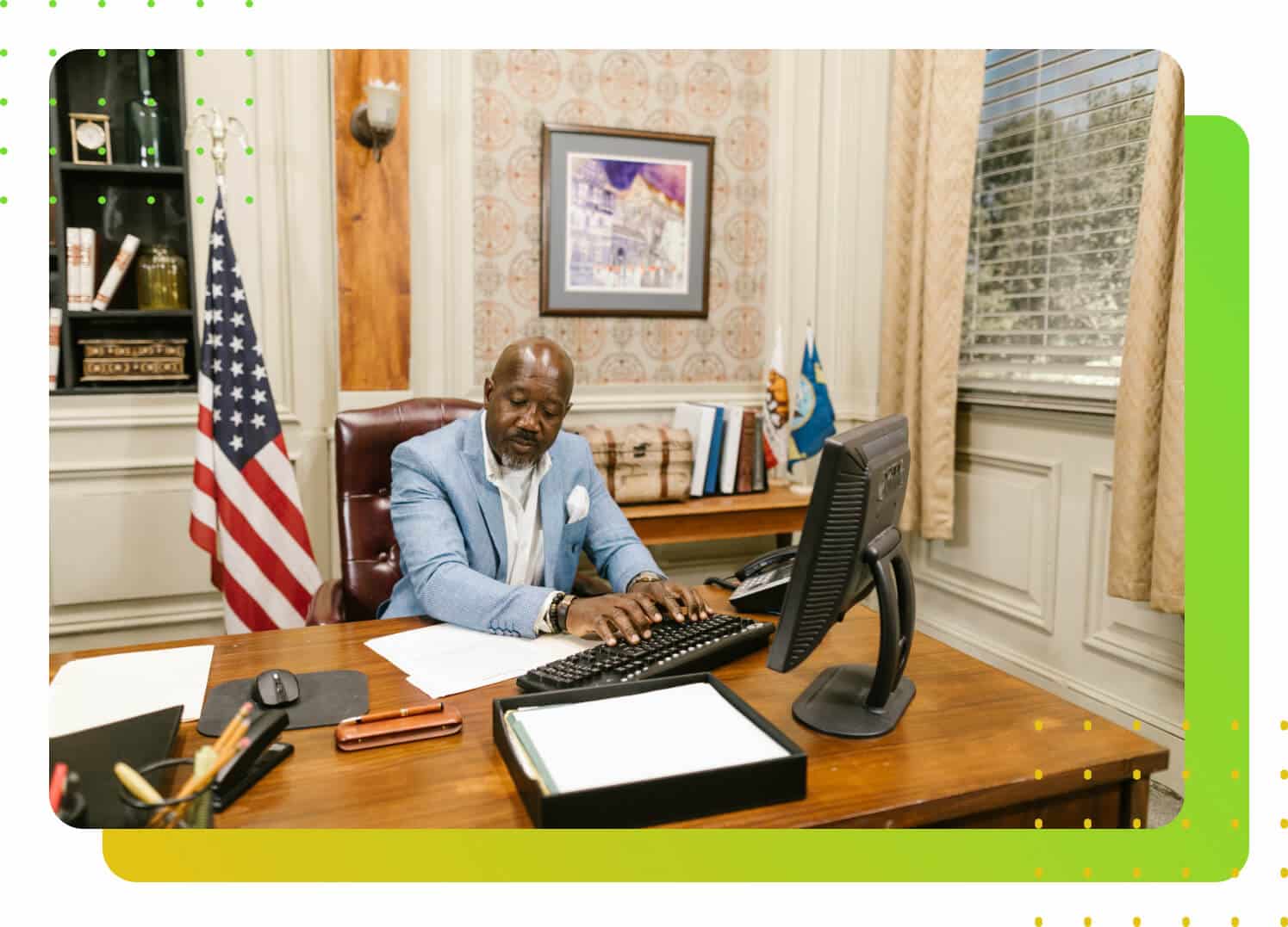 A man in suit pressing a computer