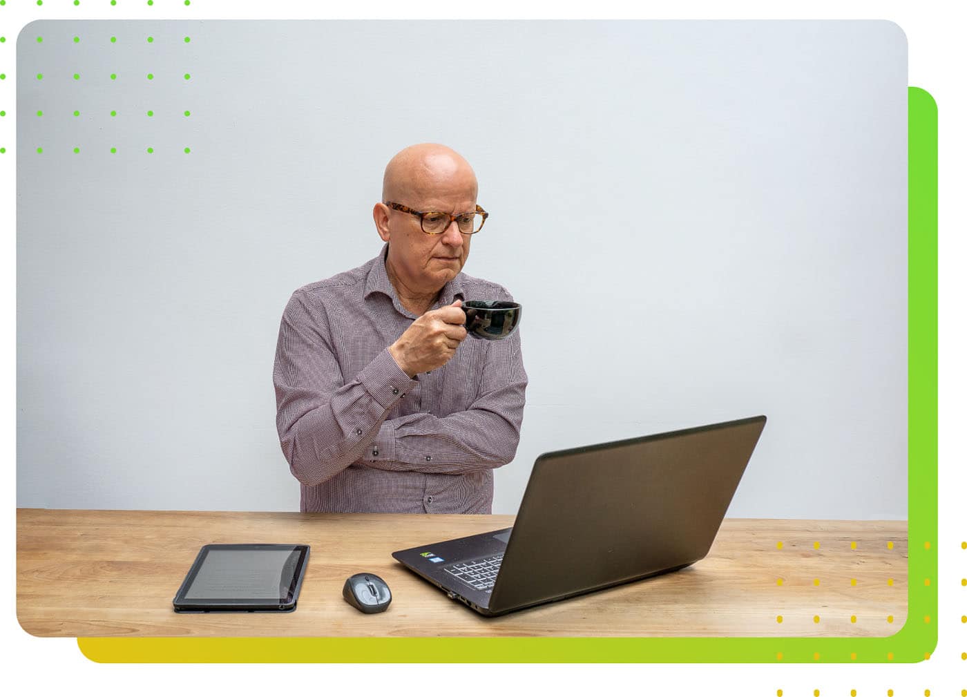 A man sipping drink while staring at the computer - LeanLaw