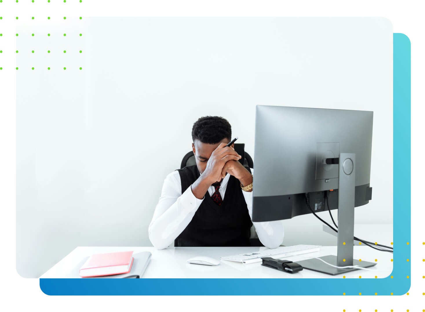 An office man looking sad behind a desktop