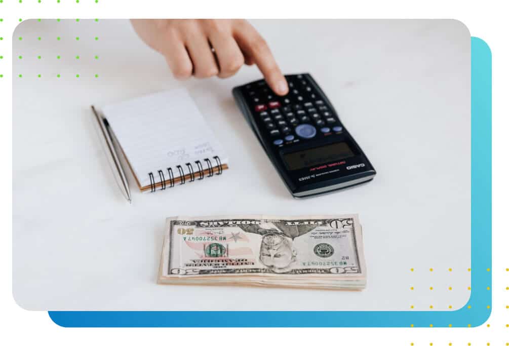 Image of a person pressing a calculator