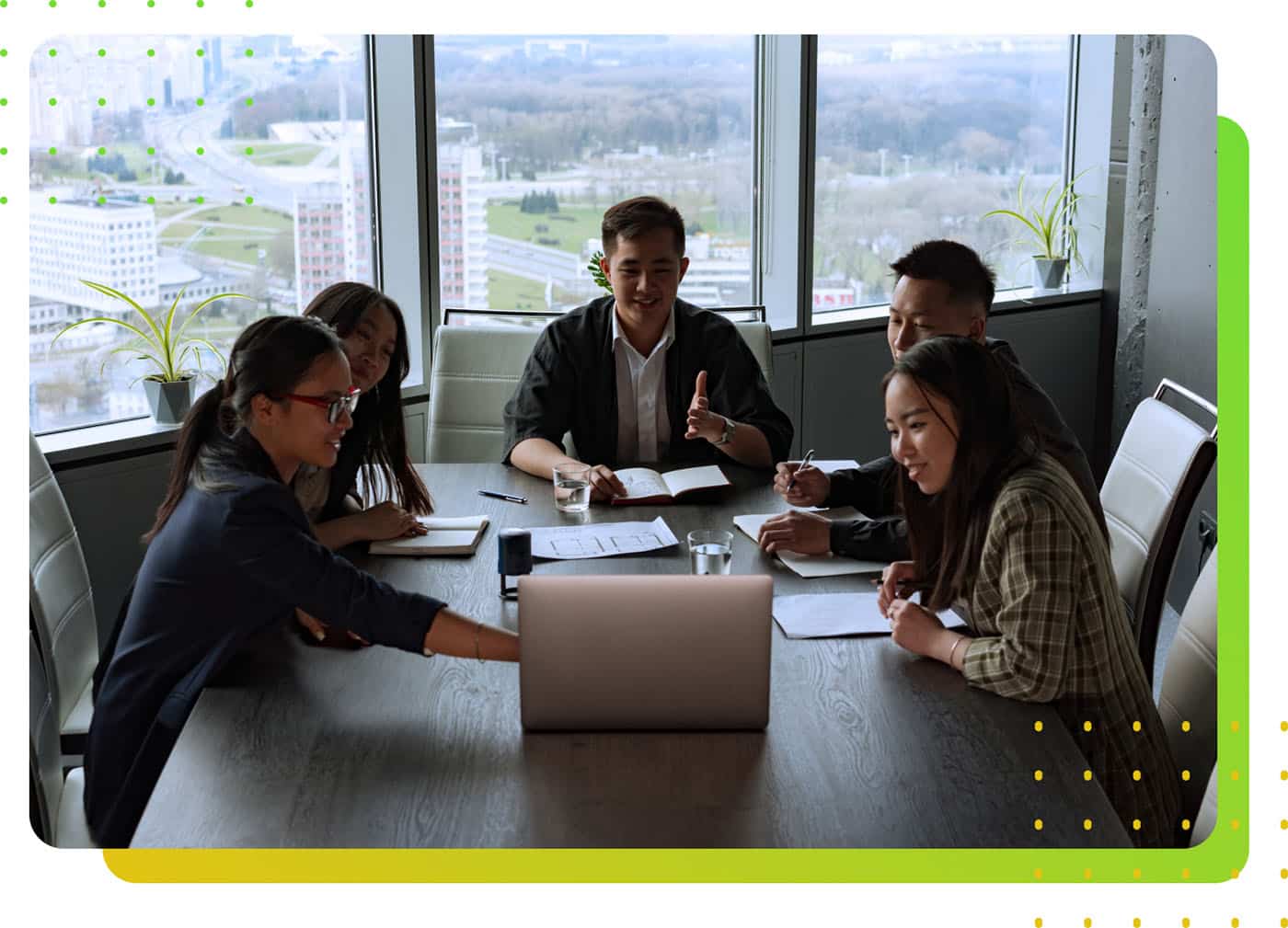 People in an office room staring at a computer - LeanLaw