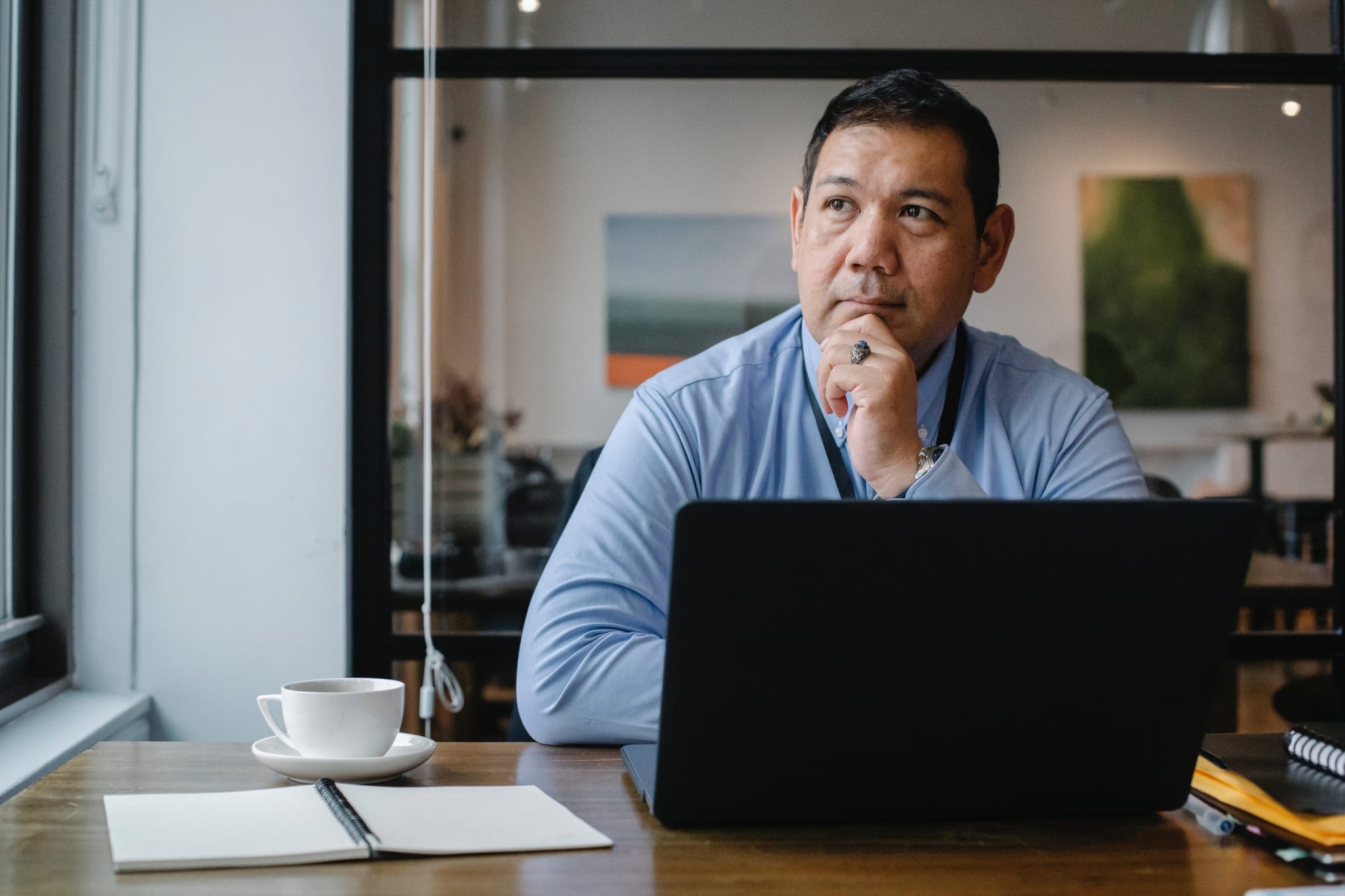 Thinking in front of laptop