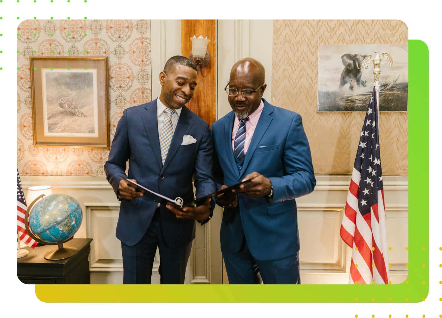 Two men in suits holding tablets