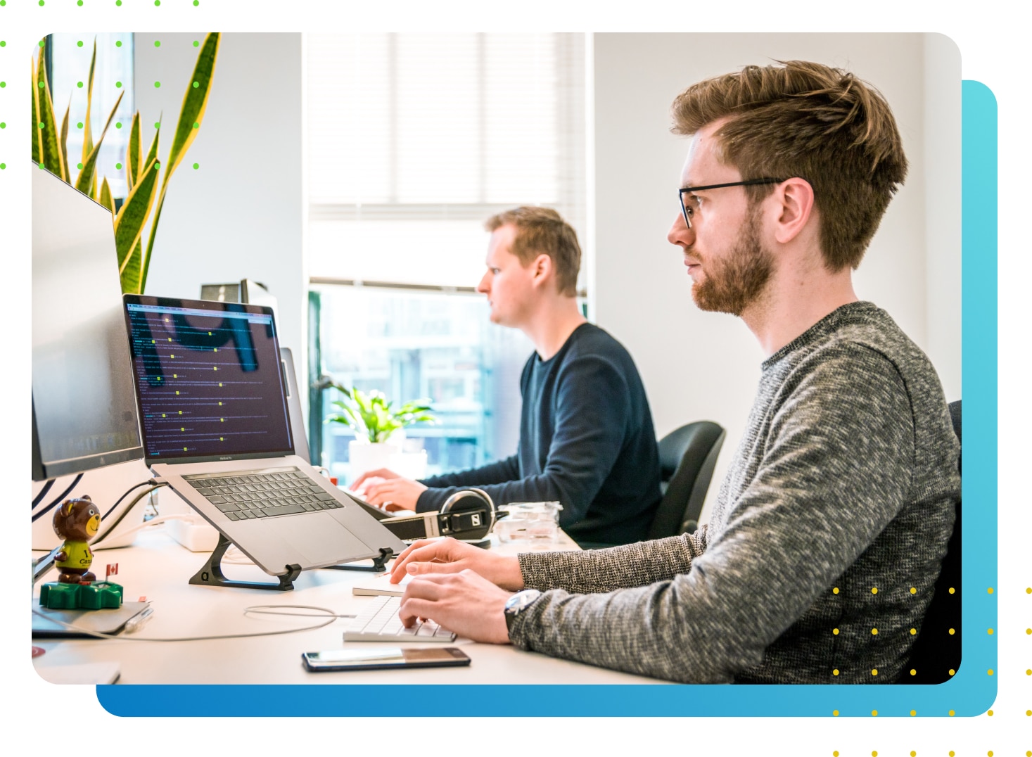 Two men staring at a computer screen